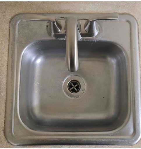 Stainless bar sink, restored to a clean shine — after