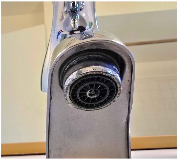 Faucet aerator, scale cleared for better flow — after