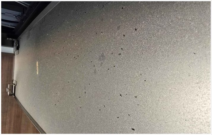Stove exhaust cover, heavy grease and dust removed — before