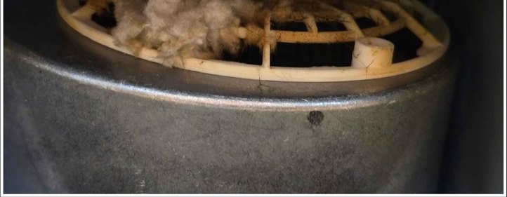 Range-hood fan, debris cleared and grease removed — before